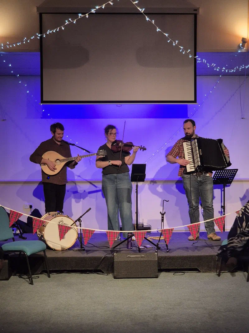 The band on a bunting-lined stage